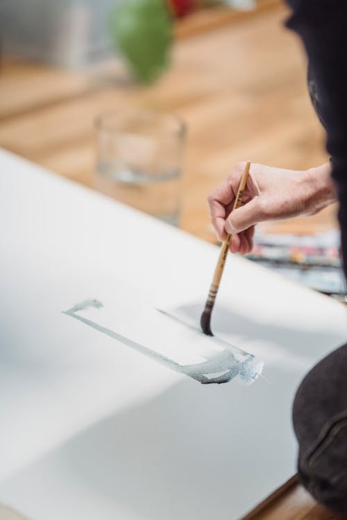 Person Painting an Artwork