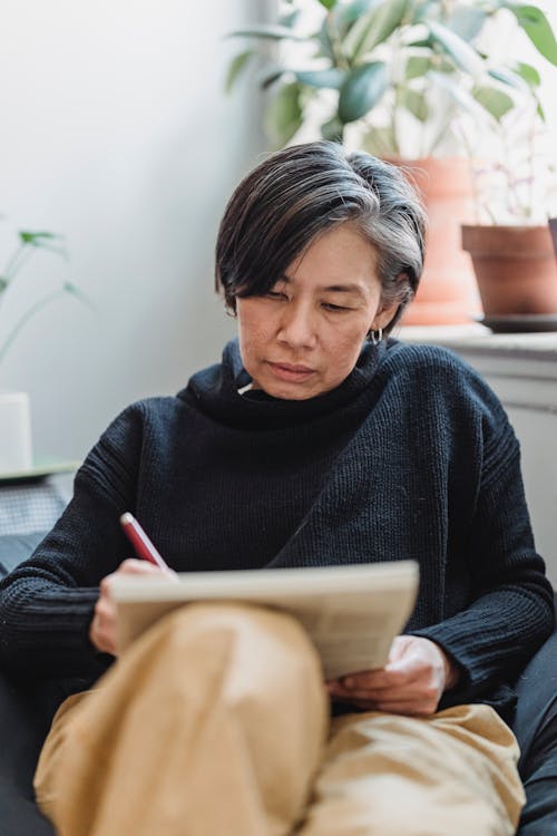 Woman Drawing an Artwork in a Sketchpad