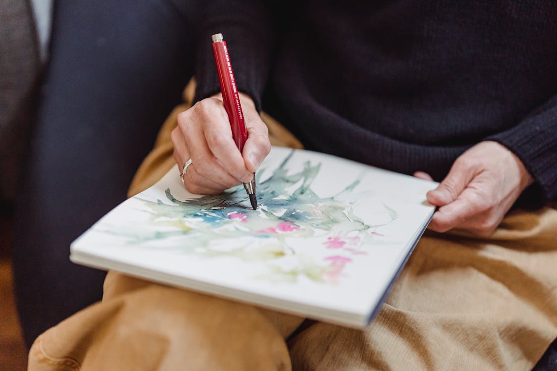 Person Drawing an Artwork · Free Stock Photo
