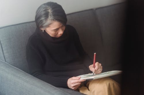 Woman Drawing an Artwork in a Sketchpad