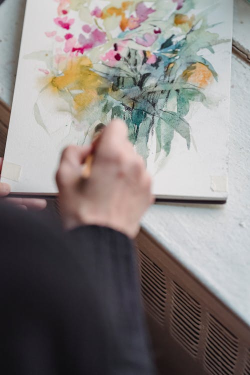 Person Painting an Artwork