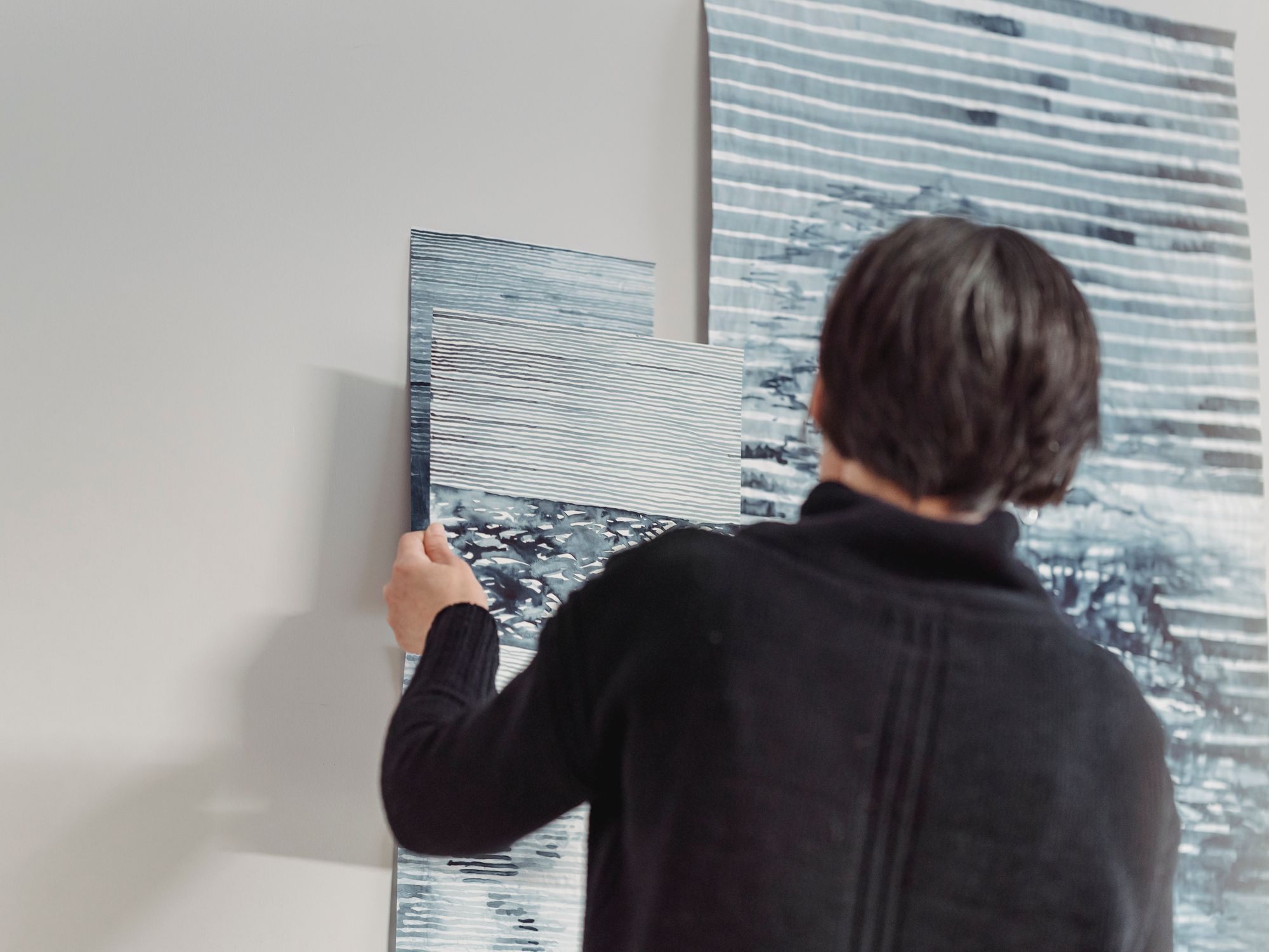 Wallpapering in Harlington, Hillingdon — decorator hanging pattern-matched wallpaper