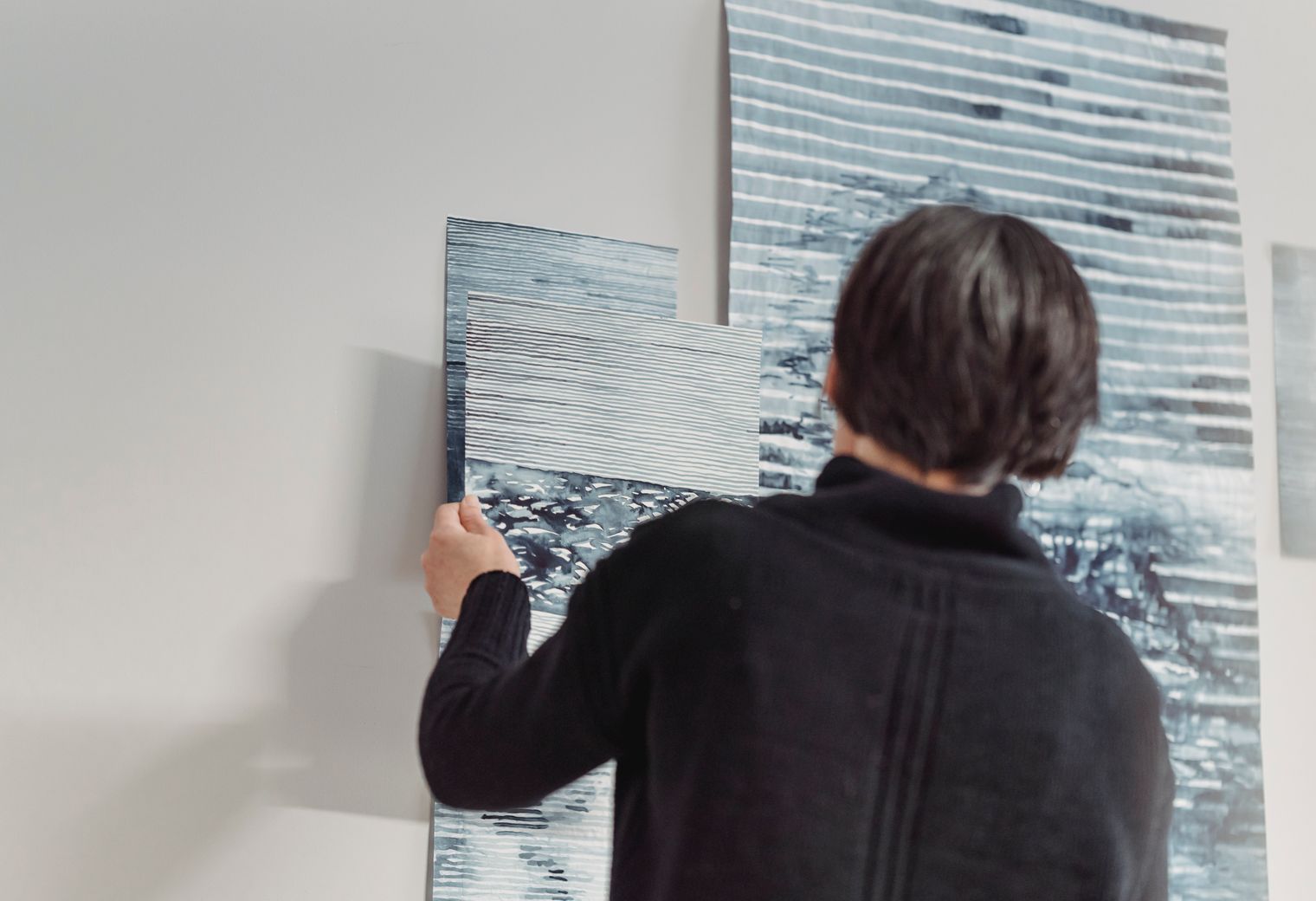 Wallpapering in Cricklewood — a decorator at work mid-project