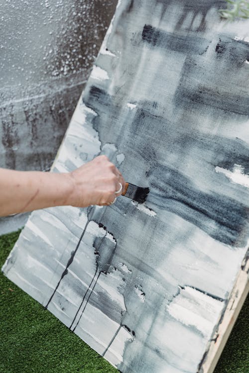 Close-Up Shot of a Painter Doing an Abstract Painting