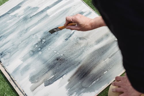 Close-Up Shot of a Painter Doing an Abstract Painting