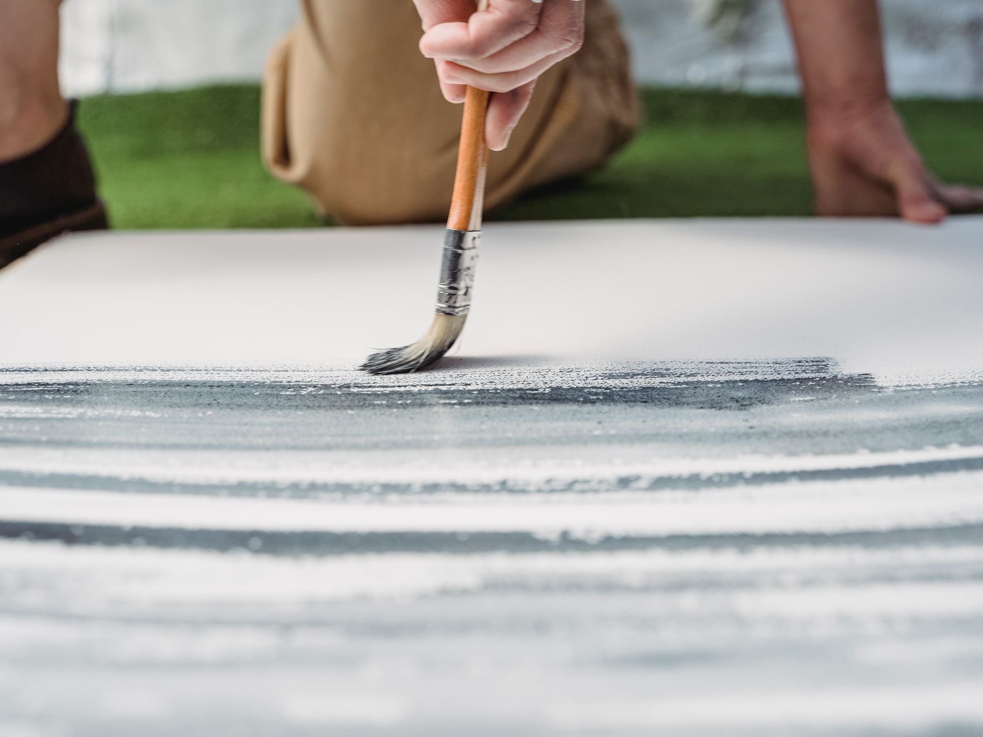 Exterior Painting in Kentish Town, Camden — painter refreshing a house exterior in weatherproof paint