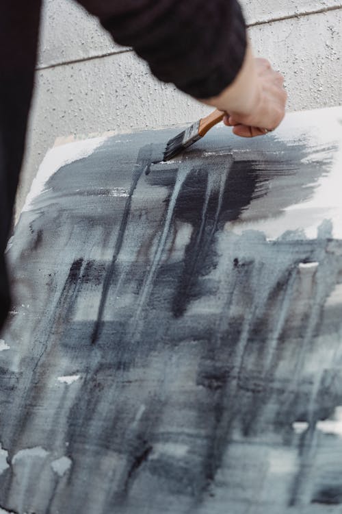 Close-Up Shot of a Painter Doing an Abstract Painting