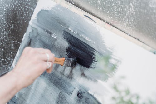 Close-Up Shot of a Painter Doing an Abstract Painting