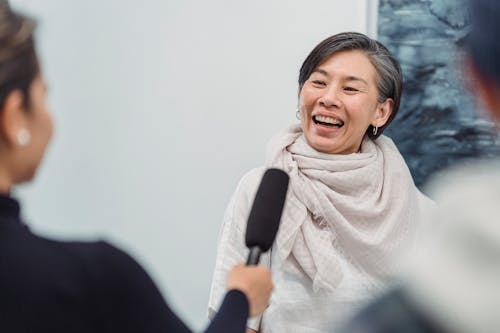 Free Laughing Woman Being Interviewed Stock Photo
