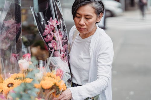 A Woman Holding a Bouquet of Flowers