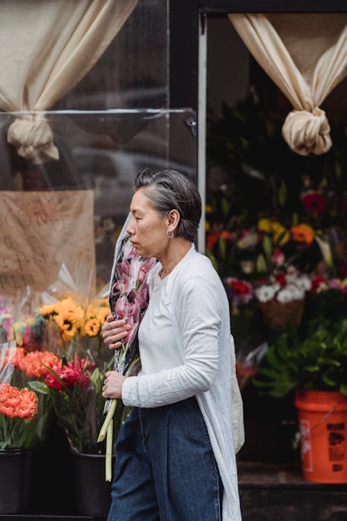 A Woman Holding a Bouquet of Flowers