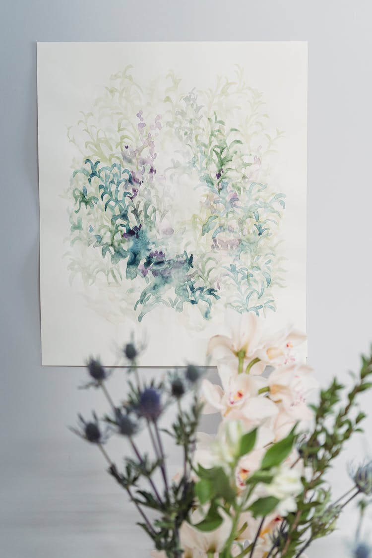 A Blooming Flowers Against A Colorful Artwork