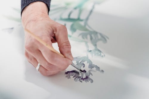 Free Person Painting an Artwork Stock Photo