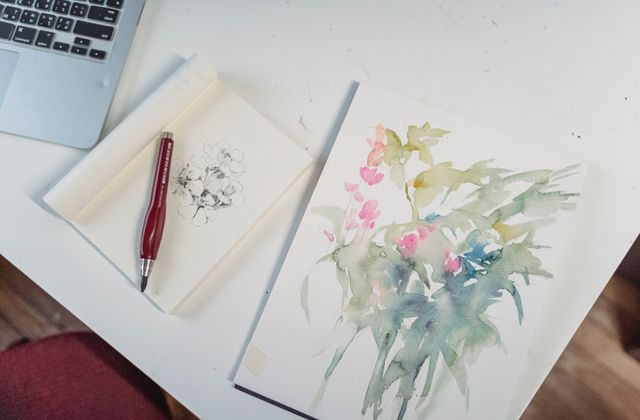 A person focusing on their own art hobby at home