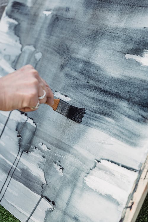 Close-Up Shot of a Painter Doing an Abstract Painting