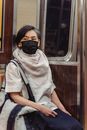 Short-Haired Woman Wearing a Black Face Mask