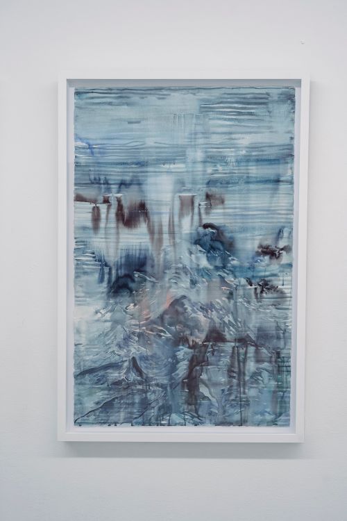 Free Abstract watercolor painting with blue tones in a white frame on a plain wall. Stock Photo