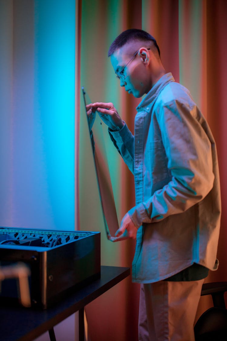 Man At Home Repairing His Computer 