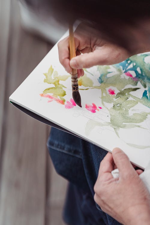 Person Painting Flowers