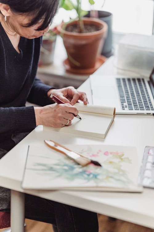 A Woman Drawing an Artwork