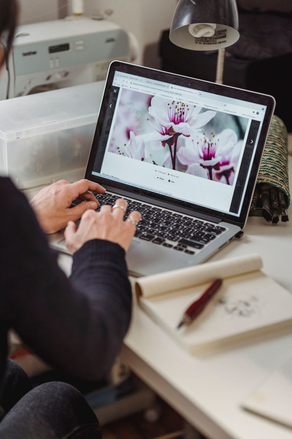 Person Browsing the Internet by Using a Laptop · Free Stock Photo