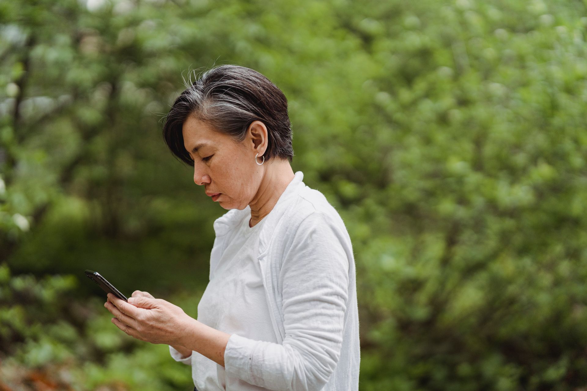 A Woman Busy Using Her Smartphone