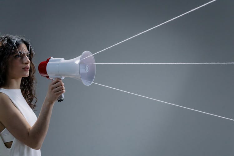 A Woman Holding A Megaphone