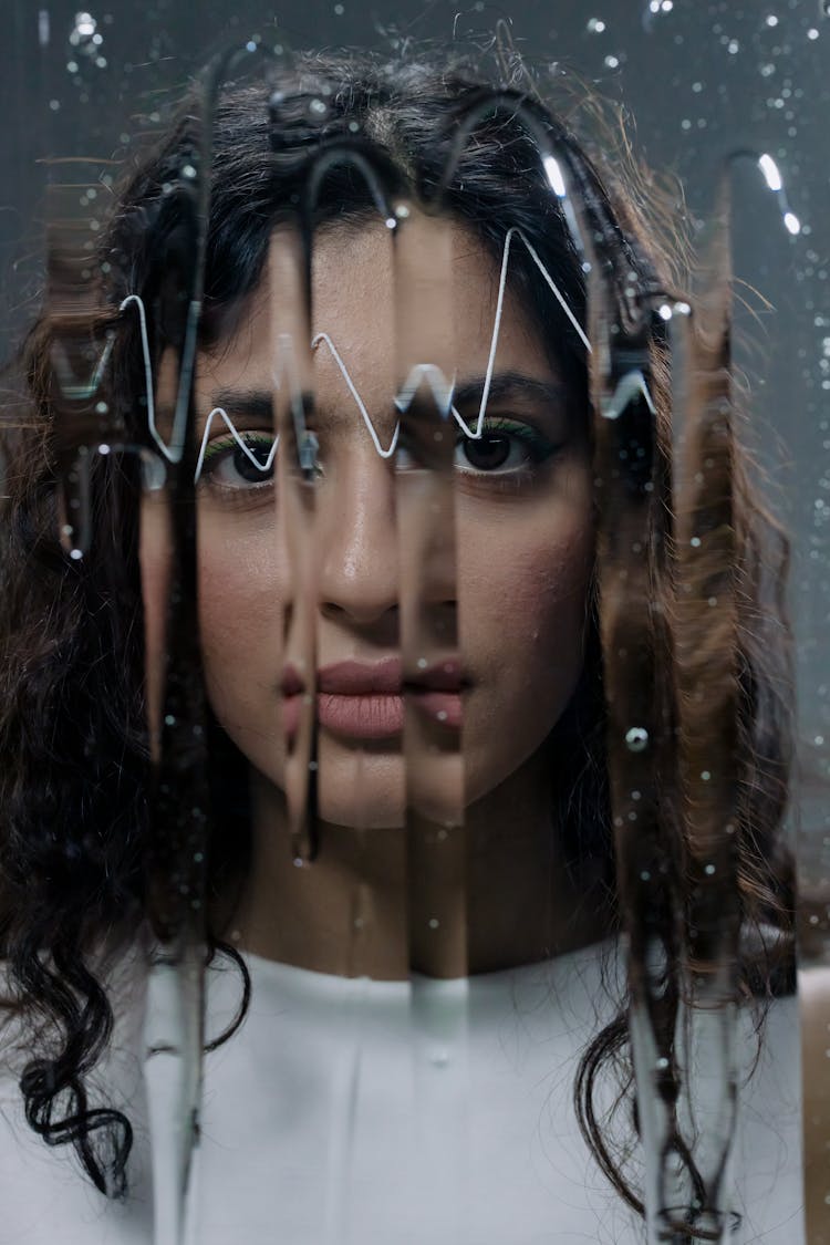 Brunette Woman Face Behind Glass