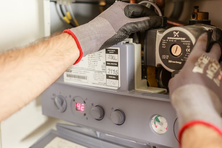 Plumber Repairing Power Source