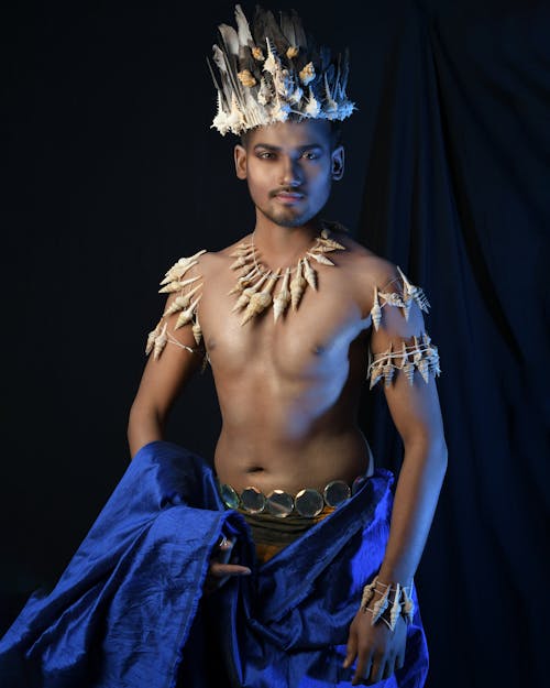 Muscular Man Wearing Costume Made with Shells 