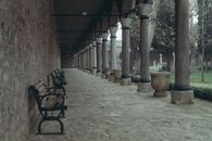 Wooden Benches Near the Block Wall