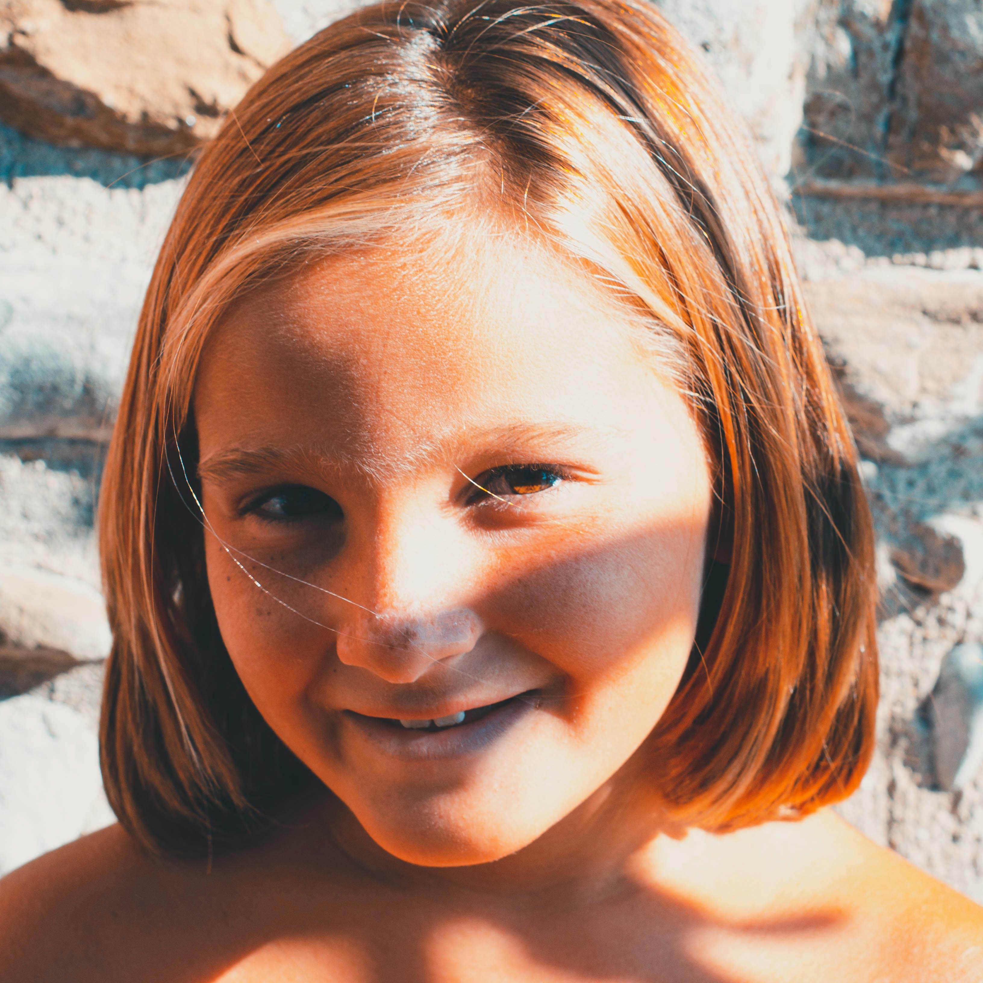 portrait of a smiling blonde girl