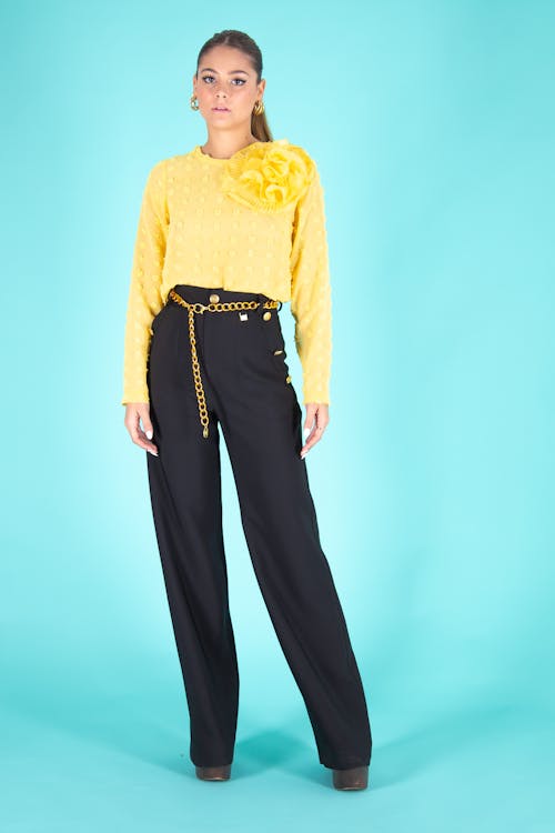 Woman in Yellow Long Sleeve Shirt and Black Pants · Free Stock Photo