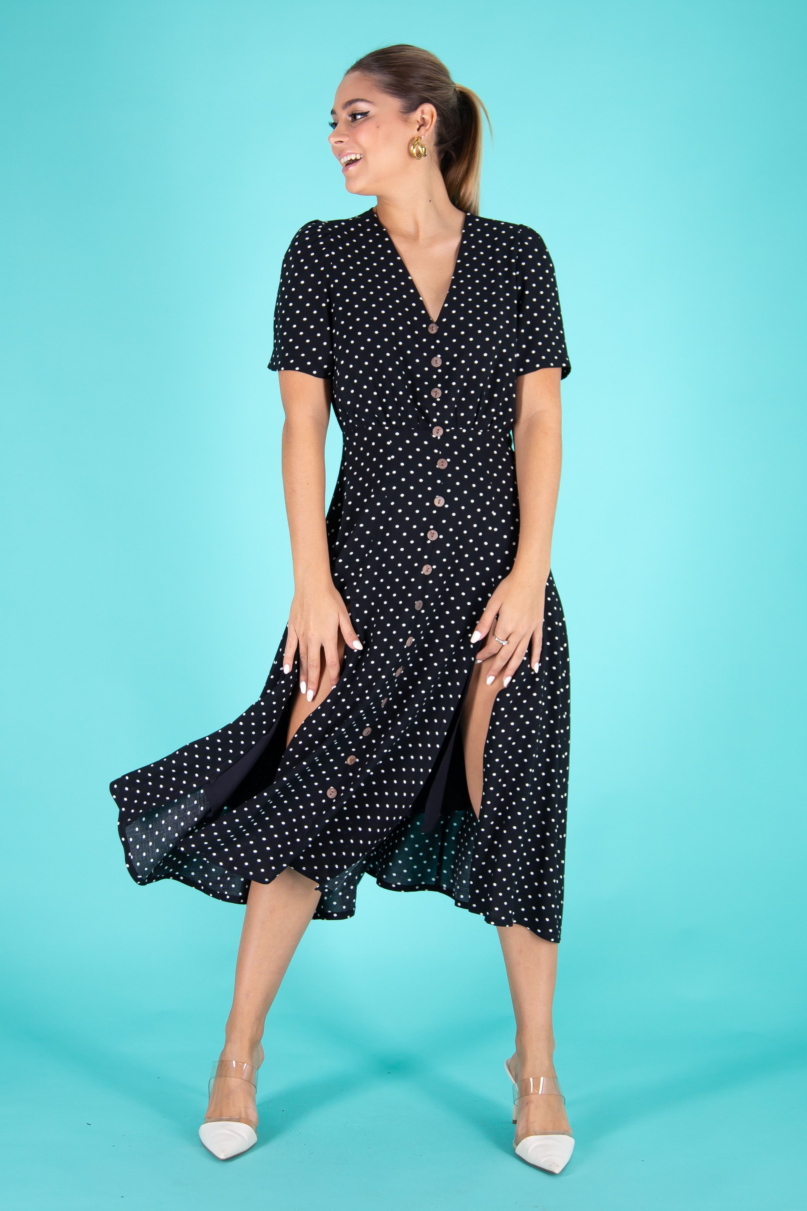 woman-in-polka-dot-dress-raising-her-hands-free-stock-photo