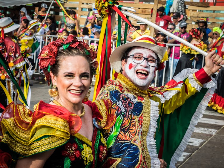 Laughing People In Costumes Celebrating Carnival