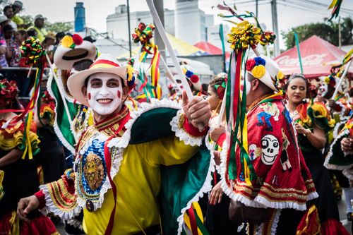Free Colorful dancers in traditional costumes celebrate during the Barranquilla Carnival parade. Stock Photo