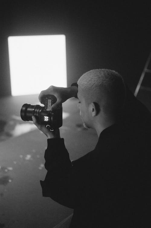 Free Grayscale Photo of a Man Taking a Picture Stock Photo