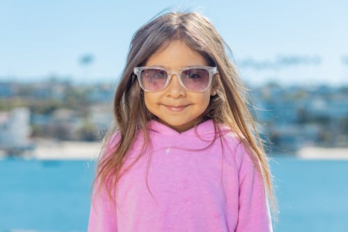 Young Girl Wearing a Pink Sweater Doing a Pose