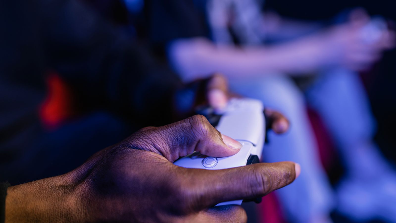 Representative licensed photograph of hands holding a video game controller; not GTA VI gameplay, a Rockstar screenshot or a confirmed game storage display