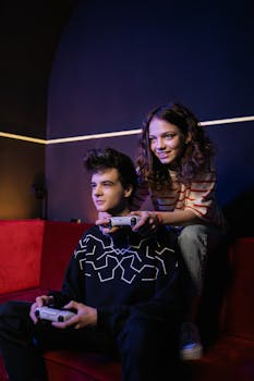 A boy and a girl enjoying video games together in a cozy indoor setting.