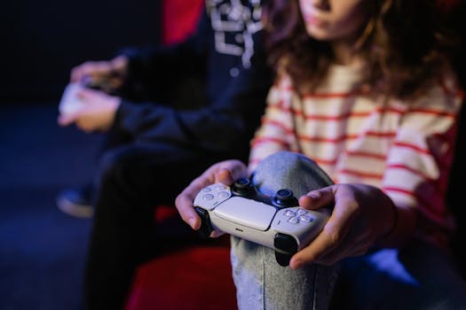 Two people enjoying a video game session with controllers indoors.