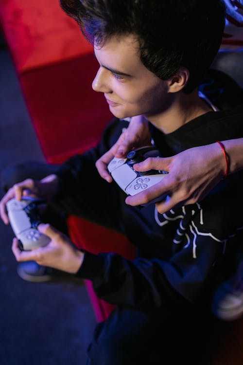 Man Holding a Controller Playing a Video Game