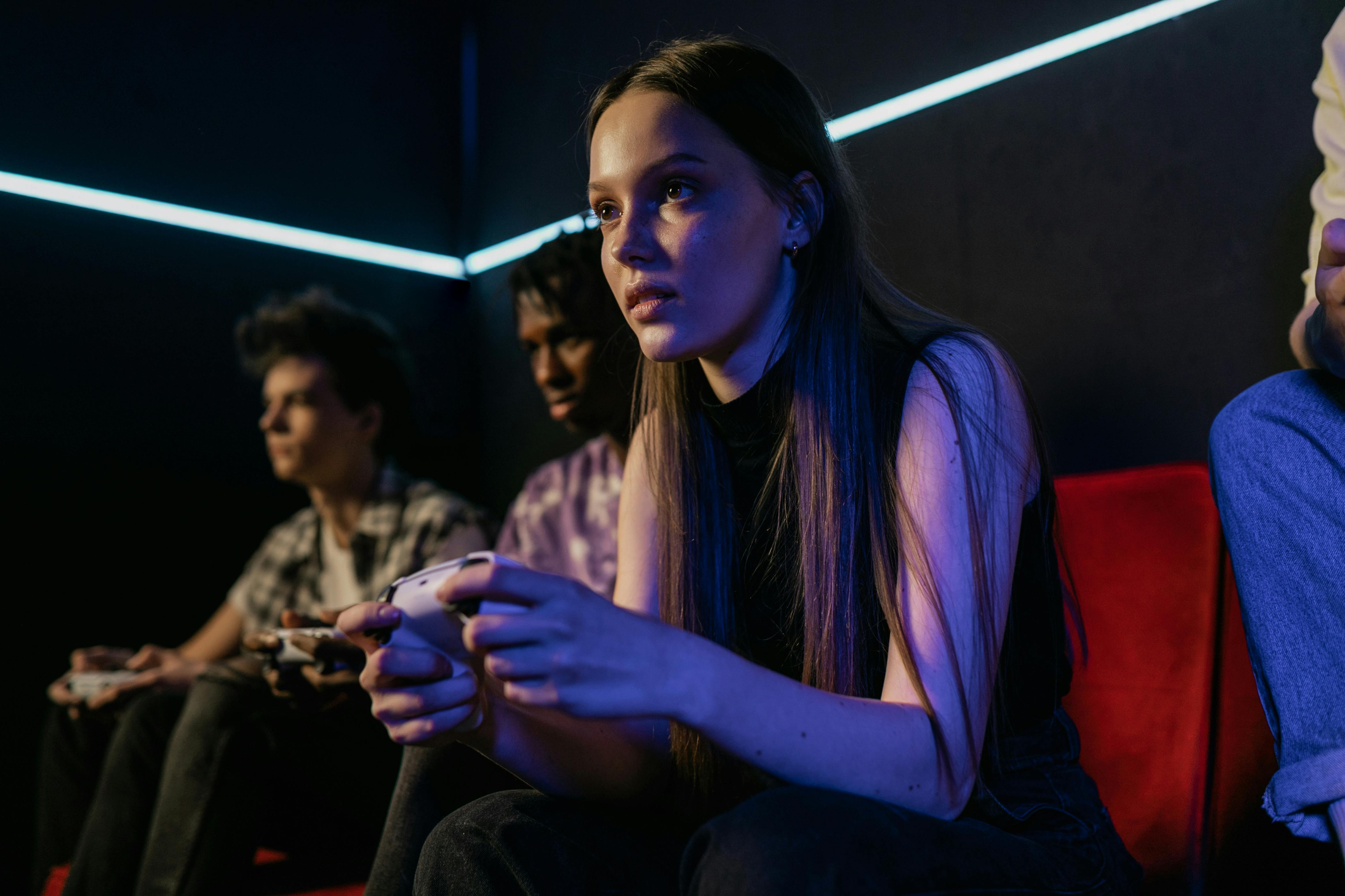 shallow focus of a girl playing video games