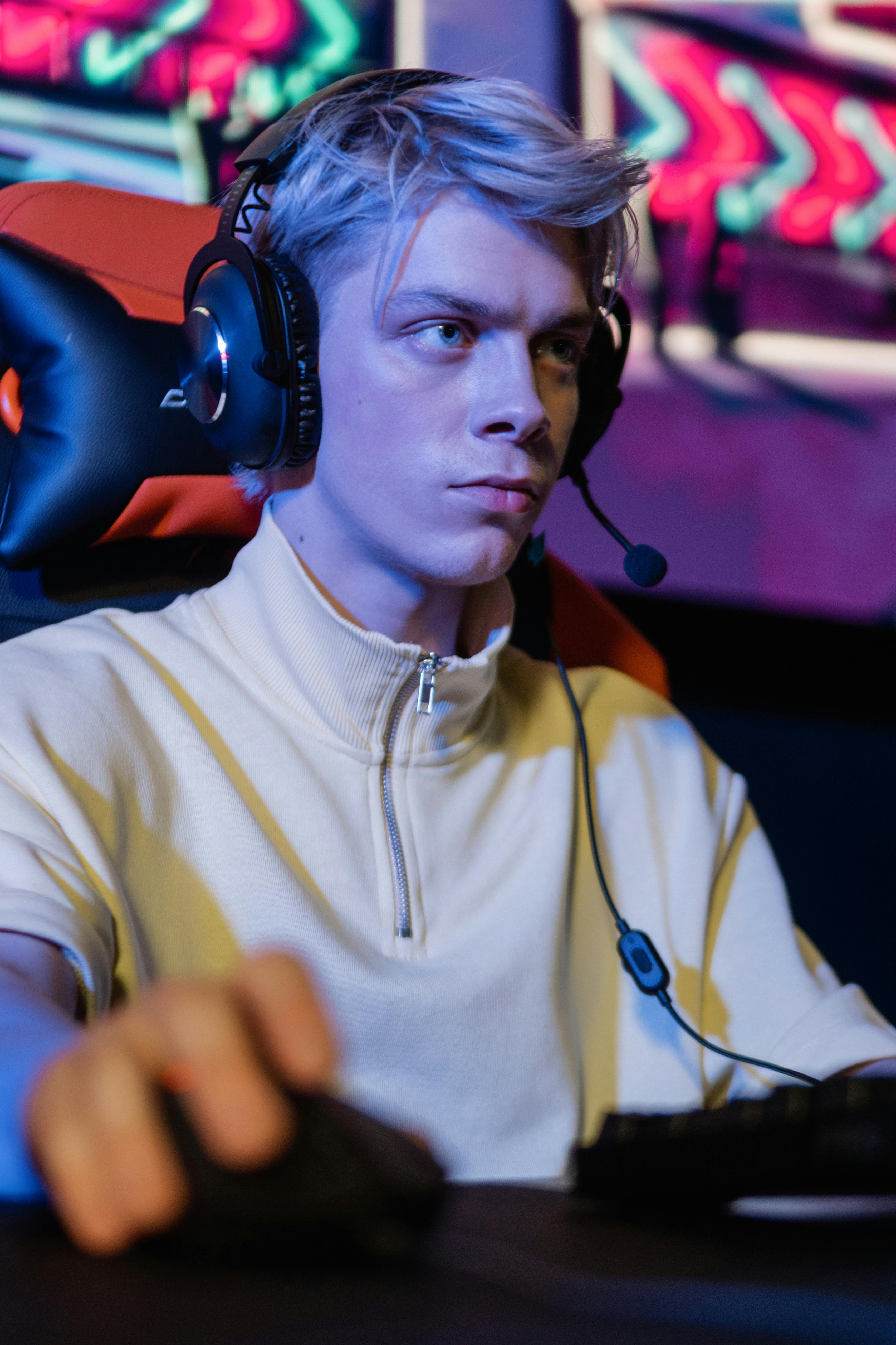 a man in turtle neck shirt wearing headset