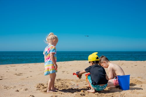 Photo of Kids Playing with Sand