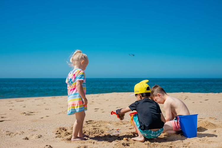 Photo Of Kids Playing With Sand