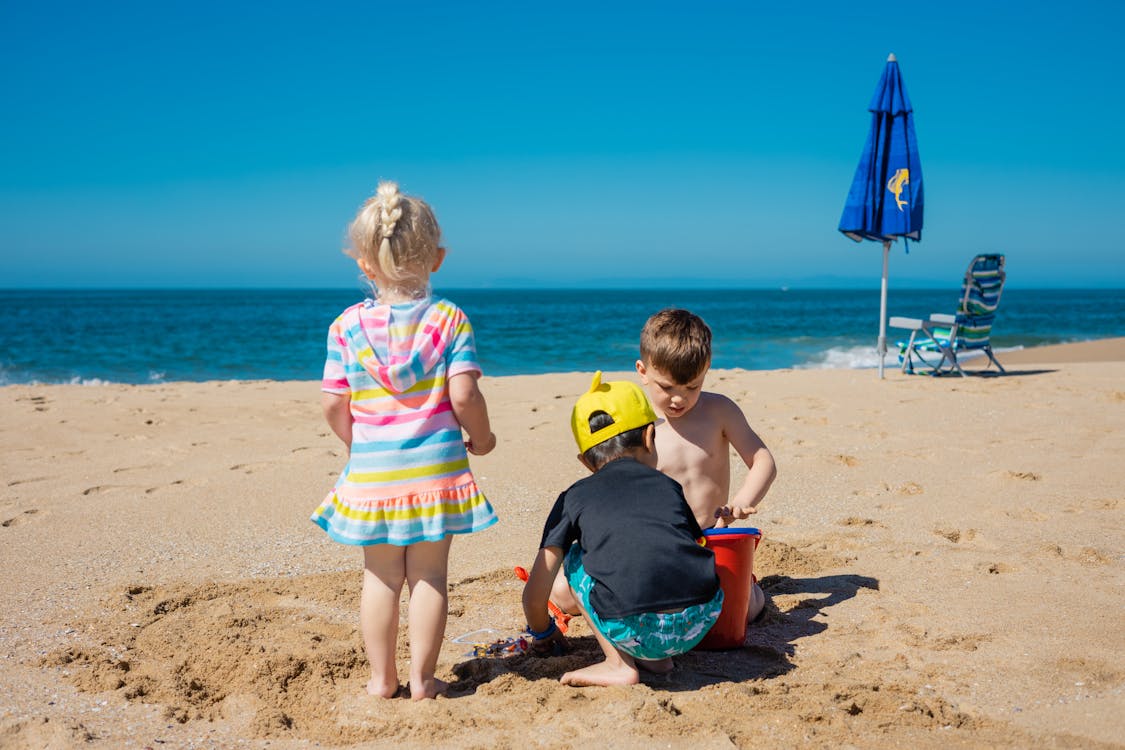 Free Children Playing on the Beach Stock Photo