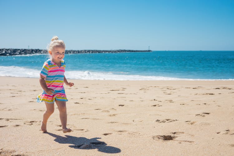 Child Running At The Beach