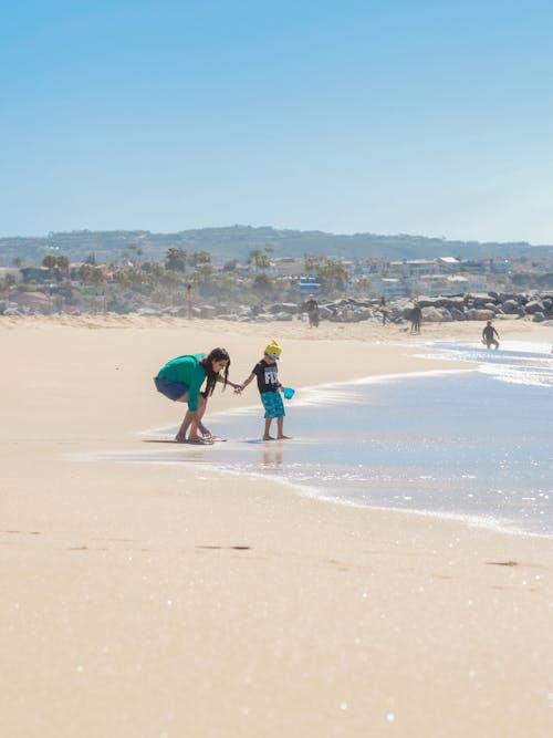 A Mother Playing with Her Son at the Beach