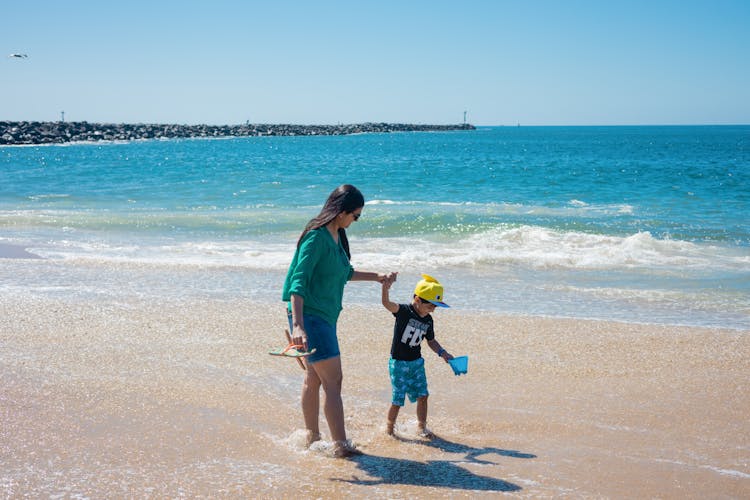 A Mother And Son At The Beach